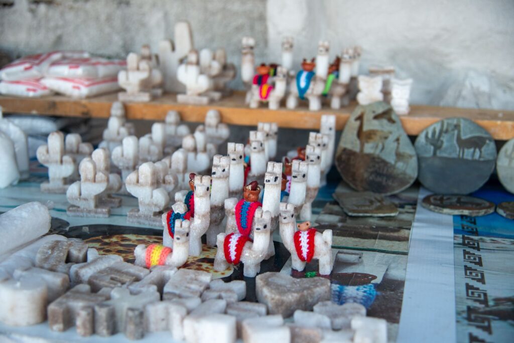 Artisan salt crafts and sculptures displayed in a Salta Province market, Argentina.